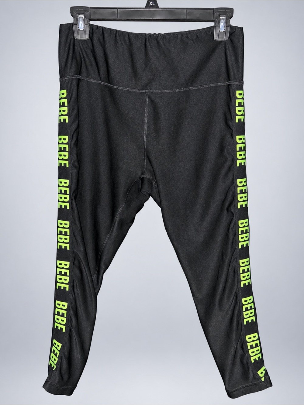 Bebe women’s capris with green logo down legs